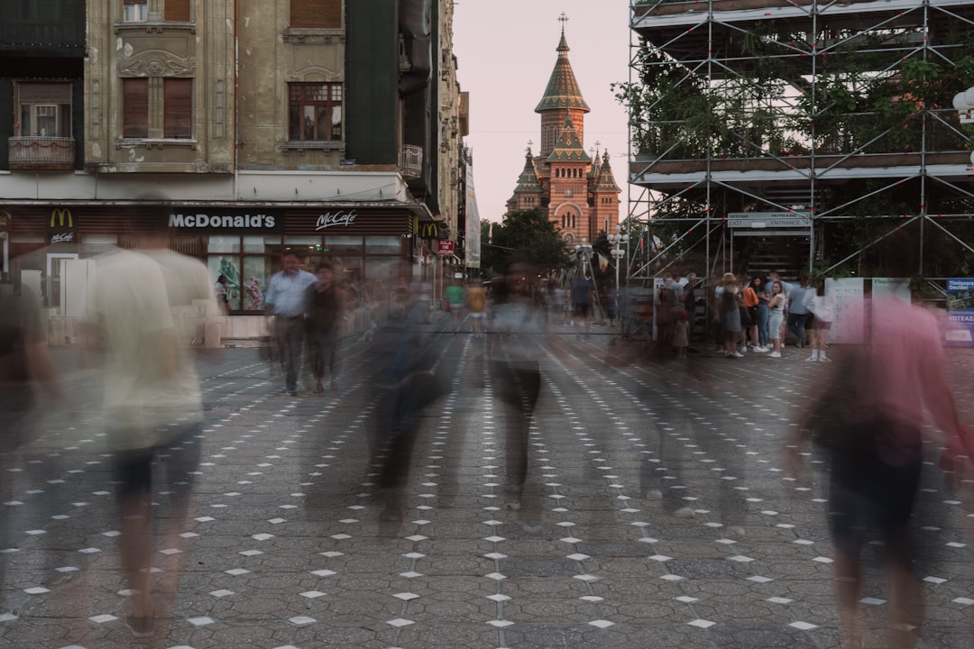 a blurry photo of people walking down a street