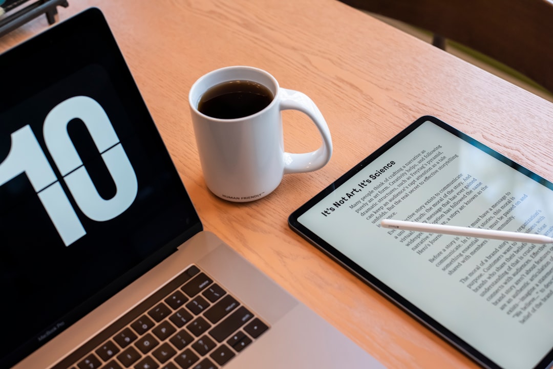 a tablet and a cup of coffee on a table